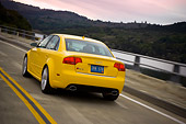 AUT 29 RK1244 01
2007 Audi RS4 Yellow 3/4 Rear View On Road In Motion