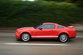 AUT 29 RK1271 01
2007 Ford Shelby Mustang GT500 Coupe Red And White Profile View On Road In Motion