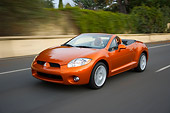 AUT 29 RK1273 01
2007 Mitsubishi Eclipse Spyder GT Orange 3/4 Front View On Road In Motion