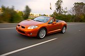 AUT 29 RK1274 01
2007 Mitsubishi Eclipse Spyder GT Orange 3/4 Front View On Road In Motion