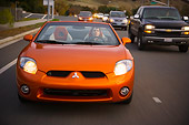 AUT 29 RK1276 01
2007 Mitsubishi Eclipse Spyder GT Orange Head On  View On Road In Motion