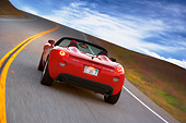 AUT 29 RK1290 01
2007 Pontiac Solstice GXP Convertible Red 3/4 Rear View On Road In Motion