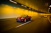 AUT 29 RK1305 01
2007 Jaguar XKR Convertible Red 3/4 Front View On Road In Motion