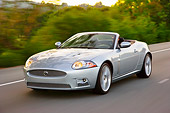 AUT 29 RK1413 01
2008 Jaguar XKR Convertible Silver 3/4 Front View On Road In Motion
