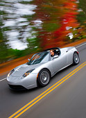AUT 29 RK1460 01
2008 Tesla Roadster Silver 3/4 Front View Driving By Autumn Trees