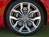 AUT 30 BK0051 01
2010 Audi R8 5.2 FSI Quattro Red Front Wheel Detail On Grass