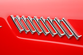 AUT 30 BK0186 01
1957 Ford Thunderbird Red With White Top Logo Detail In Studio