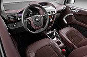 AUT 30 IZ1543 01
2013 Aston Martin Cygnet Micro Car Tan Interior Detail In Studio