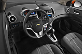 AUT 30 IZ1719 01
2013 Chevrolet Sonic LT 5-Door Hatchback Orange Interior Detail In Studio