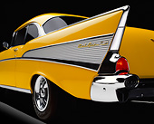 AUT 30 RK0031 03
1957 Chevy Bel Air Yellow Low Side Rear Tail Fin On Yellow Floor Studio Background Brake Lights On