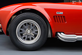 AUT 30 RK6229 01
1966 Shelby AC Cobra Red With White Stripes Front Wheel Detail In Studio