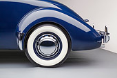 AUT 30 RK6326 01
1937 Cord Supercharged 812 Phaeton Blue Rear Wheel Detail In Studio
