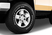 AUT 30 IZ0477 01
2013 Toyota FJ Cruiser Yellow Front Wheel Detail Studio