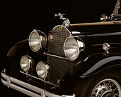 AUT 30 RK0115 02
1930 Black Packard 850 Roadster Detail Front Hood And Emblem Studio Background