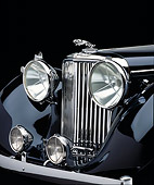 AUT 30 RK0315 05
Detail Shot Of A 1948 Jaguar Drophead Black Front Grill Headlights And Hood Ornament Studio