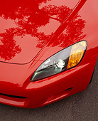 AUT 30 RK0421 04
2000 Honda S Convertible Red Overhead Of Front Headlight On Pavement