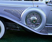 AUT 30 RK0641 02
1931 Duesenberg J Detail Side Spare Tire With Cover Profile View On Grass