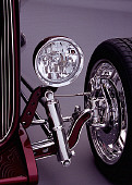 AUT 30 RK1877 03
1932 Ford Custom Roadster Burgundy Headlight And Suspension Detail