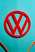 AUT 30 RK2060 01
1957 Volkswagen Bus Emblem Red On Light Blue Body Panel Head On View