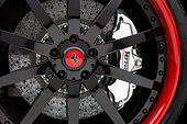 AUT 30 RK4310 01
2008 Ferrari 612 Scaglietti Sessanta Black And Maroon Front Wheel Detail Studio