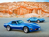 AUT 31 RK0112 01
1975 And 1969 Chevrolet Corvettes Blue 3/4 Front View On Pavement By Red Rock
