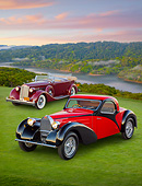 AUT 31 RK0115 01
1937 Bugatti Type 57 S Atalante Coupe Red And Black And 1936 Packard Super 8 Dual Cowl Phaeton Maroon 3/4 Front View On Grass At Dusk