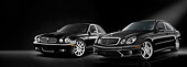 AUT 31 IZ0001 01
2008 Jaguar XJ8 And 2009 Mercedes-Benz E63 Black 3/4 Front View Studio