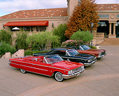 AUT 31 RK0035 08
1963 Red & 1963 1/2 Black & 1966 Emberglo Ford Galaxies 3/4 Front View By Trees And Building