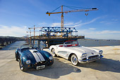 AUT 31 RK0069 01
1966 Shelby Cobra 427 SC Replica Blue And White And 1960 Chevrolet Corvette White On Pavement