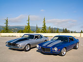AUT 31 RK0071 01
1973 And 1968 Chevy Camaro Blue And Silver 3/4 Front Overhead On Pavement