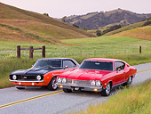 AUT 31 RK0092 01
1969 Chevrolet Camaro And 1968 Chevelle 3/4 Front View On Road By Hills