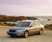 AUT 33 RK0007 02
2000 Nissan Maxima Gray 3/4 Front View On Sand By Ocean Filtered