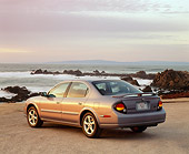 AUT 33 RK0008 01
2000 Nissan Maxima Gray 3/4 Rear View On Sand By Ocean Filtered