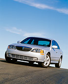 AUT 33 RK0012 02
2000 Lincoln LS Sport Sedan Silver 3/4 Low Slanted Front View On Pavement Hill Blue Sky