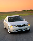 AUT 33 RK0016 02
2000 Lincoln LS Sport Sedan Silver 3/4 Front View On Pavement By Grass Hills Filtered