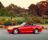 AUT 33 RK0050 02
Honda S 2000 Convertible Red Profile View On Pavement By Flowers And Trees At Dusk