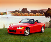 AUT 33 RK0053 01
Honda S 2000 Convertible Red Front 3/4 View On Grass By Water Fountain Filtered