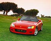AUT 33 RK0060 01
Honda S 2000 Convertible Red 3/4 Front View On Grass Trees Background Filtered