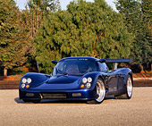 AUT 33 RK0099 03
2000 Ultima GTR Blue 3/4 Front View On Pavement Trees Background