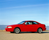 AUT 33 RK0154 03
2000 Volvo C70 Red 3/4 Side View On Pavement By Water Blue Sky