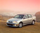 AUT 33 RK0180 02
2000 Infiniti G20 Touring Model Silver 3/4 Front View On Dirt By Ocean Foggy Filtered