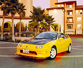 AUT 33 RK0324 02
2000 Acura Integra Type R Yellow 3/4 Front View By Building And Palm Trees Filtered