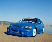 AUT 33 RK0333 01
2000 Honda Civic Custom Blue Low 3/4 Front View On Pavement By Water