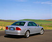 AUT 33 RK0013 01
2000 Lincoln LS Sport Sedan Silver 3/4 Rear View On Pavement By Grass Hills