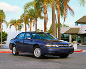 AUT 33 RK0026 02
2000 Chevrolet Impala Blue Front 3/4 View On Pavement By Palm Trees And Water Fountain