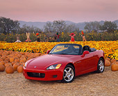 AUT 33 RK0043 02
Honda S 2000 Convertible Red Front 3/4 View By Pumpkins Flowers And Scarecrows