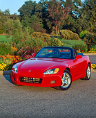 AUT 33 RK0047 02
Honda S 2000 Convertible Red Front 3/4 View On Pavement By Flowers And Trees At Dusk