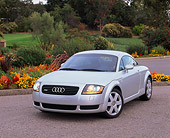 AUT 33 RK0076 12
2000 Audi Quattro TT Coupe Silver 3/4 Front View On Pavement By Flowers And Grass