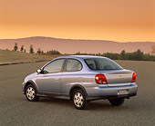 AUT 33 RK0088 05
2000 Toyota Echo Coupe Silver 3/4 Rear View On Pavement Mountains Filtered