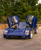 AUT 33 RK0093 02
2000 Ultima GTR Blue 3/4 Front View Doors Open On Pavement By Trees